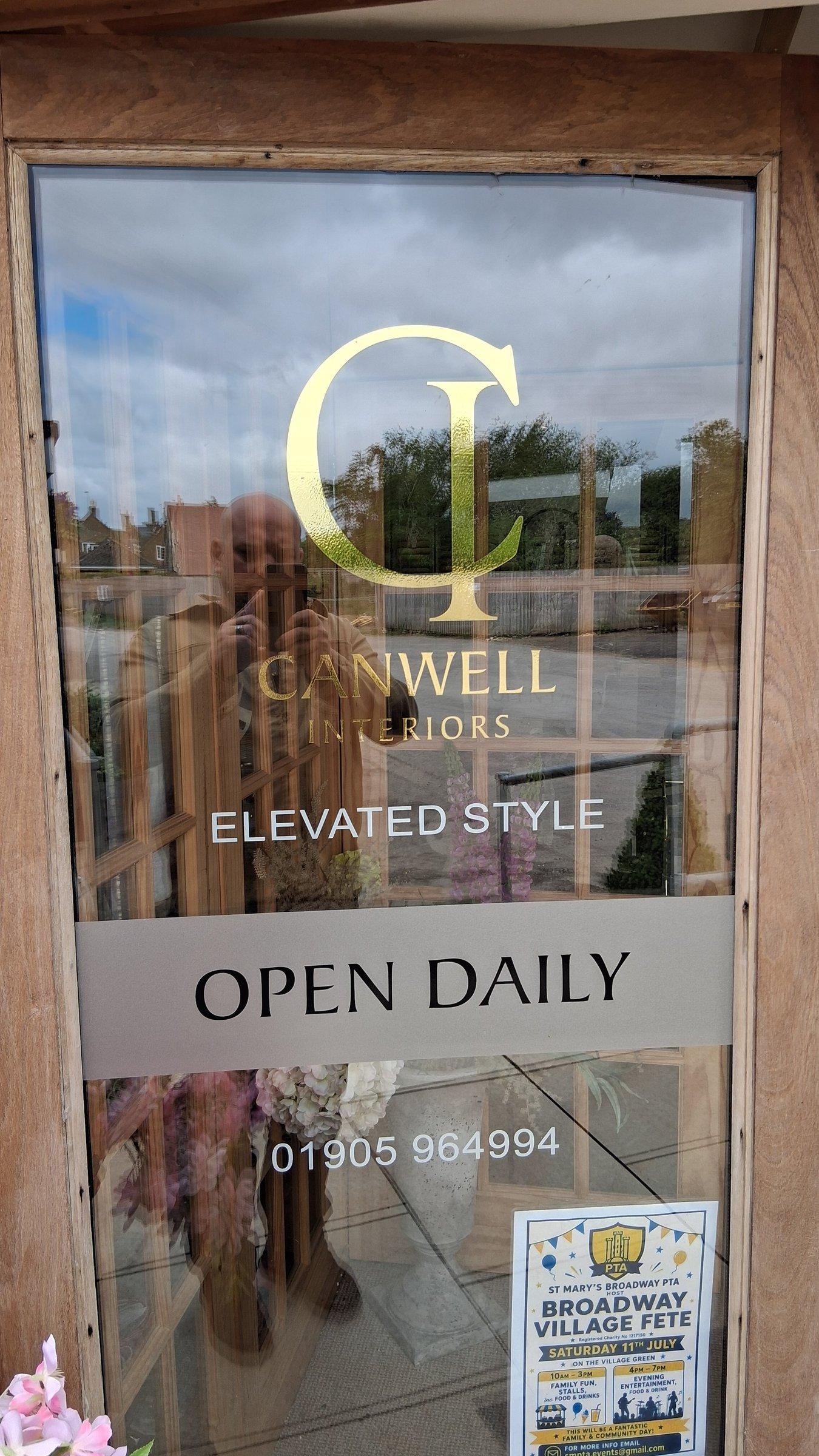 Canwell Interiors front door with logo, open daily signage and Broadway showroom phone number
